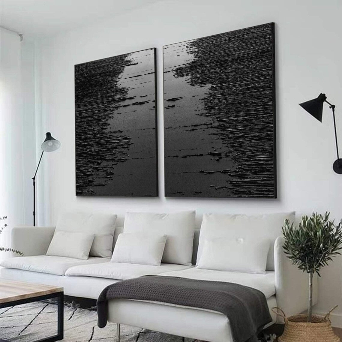 Black abstract wall art diptych with raised strokes creating a wave-like texture.