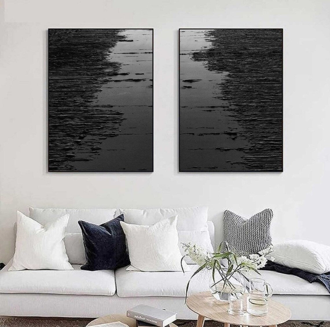 Black abstract wall art diptych with raised strokes creating a wave-like texture.