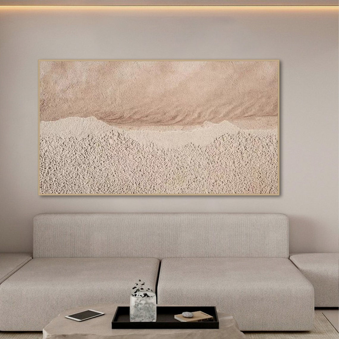 Neutral textured abstract wall art in sandy beige and muted pink tones with tactile surface.