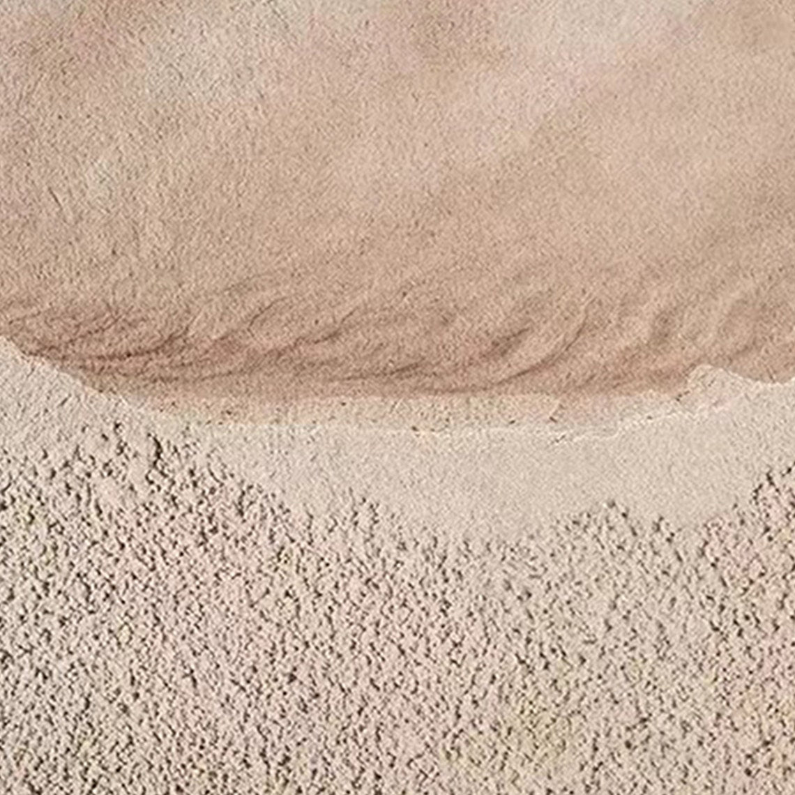 Neutral textured abstract wall art in sandy beige and muted pink tones with tactile surface.