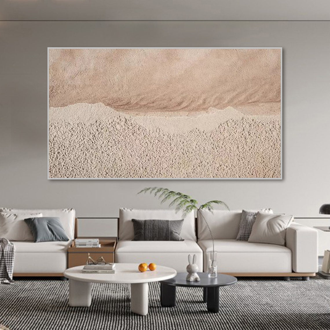 Neutral textured abstract wall art in sandy beige and muted pink tones with tactile surface.