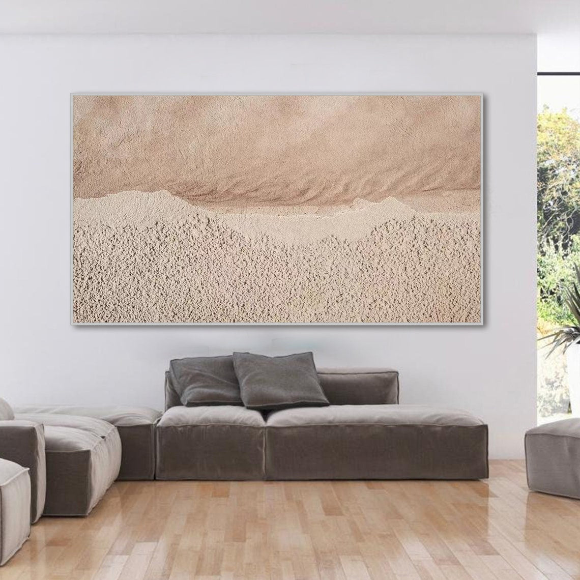 Neutral textured abstract wall art in sandy beige and muted pink tones with tactile surface.