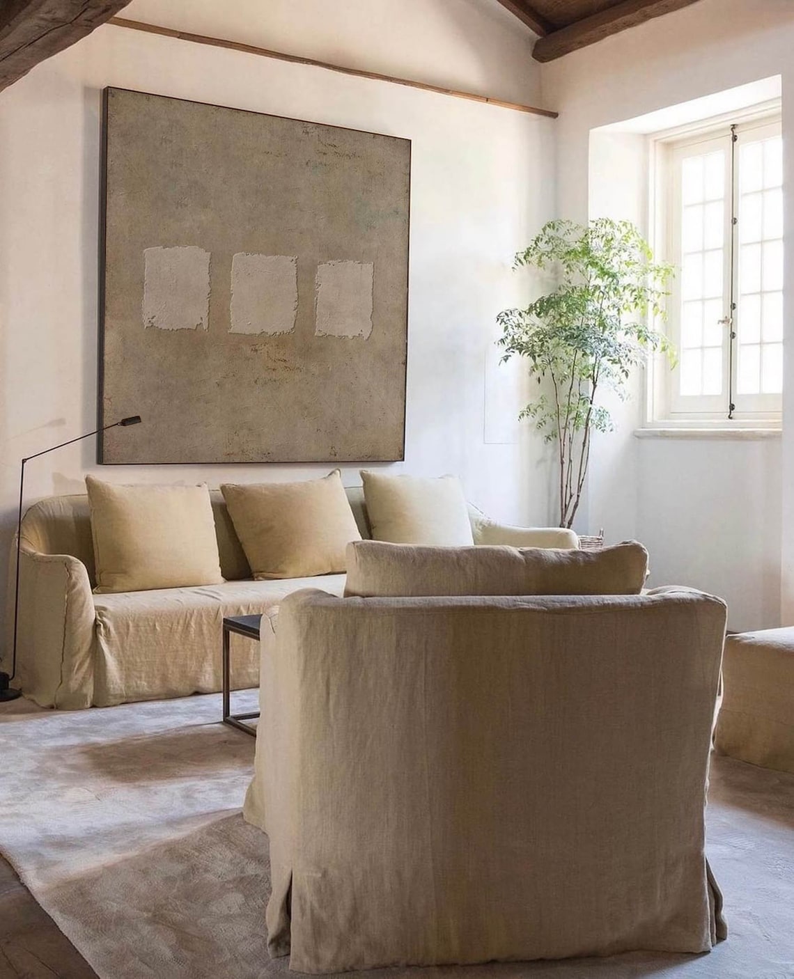 Wabi-sabi abstract textured wall art with three minimalist square patches on earthy taupe canvas.