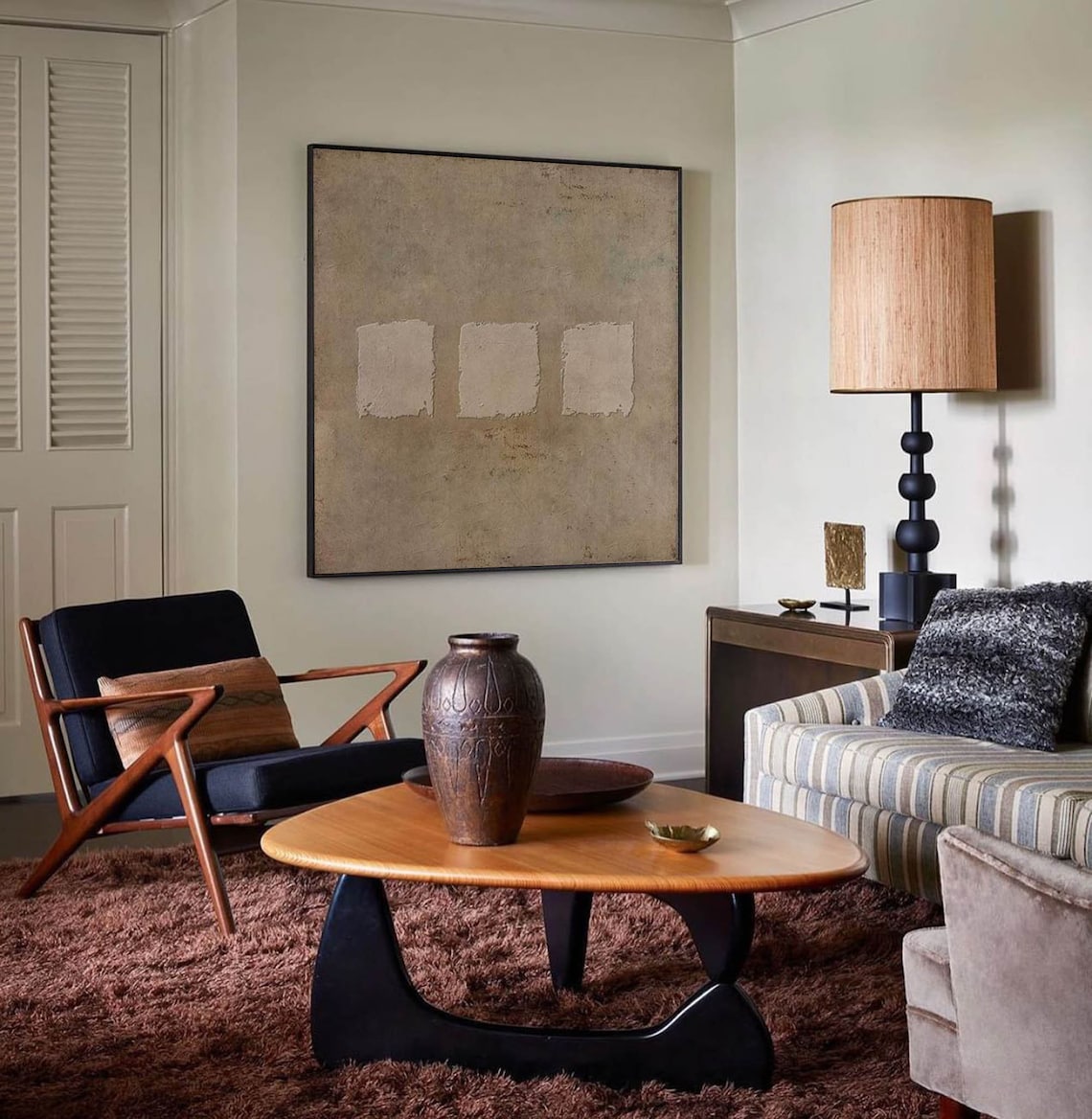 Wabi-sabi abstract textured wall art with three minimalist square patches on earthy taupe canvas.