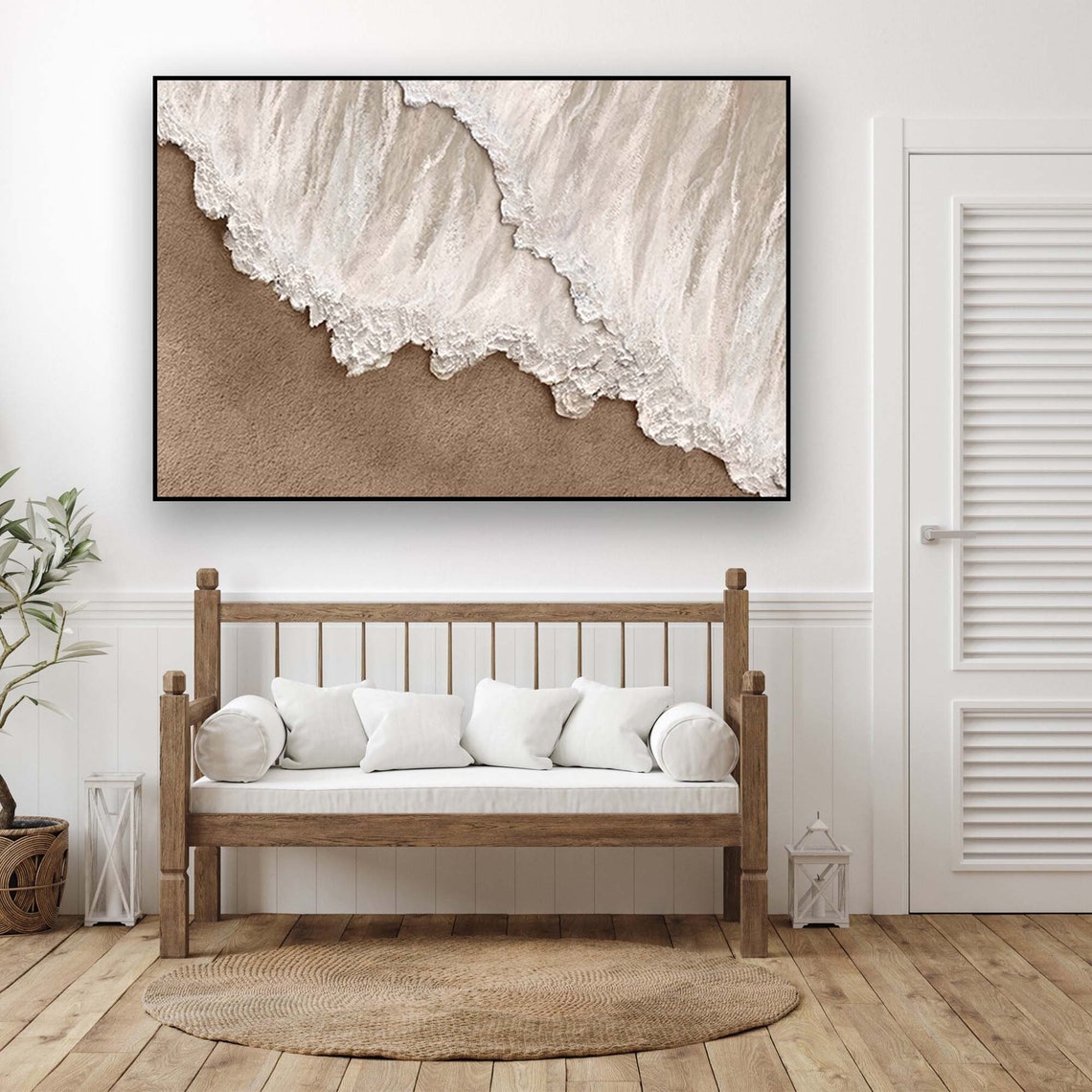 Neutral ocean abstract wall decor with textured white waves meeting sandy shore.