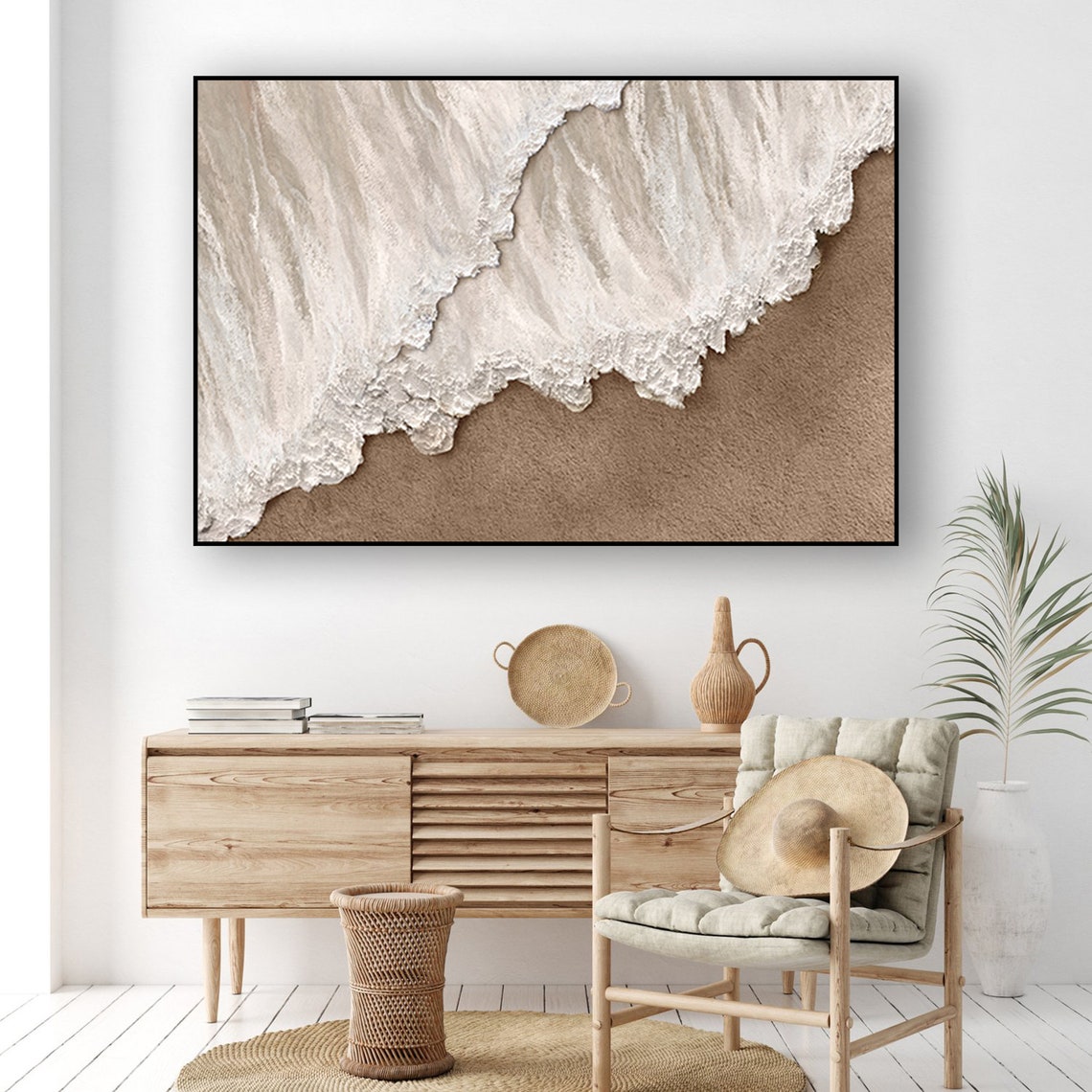 Neutral ocean abstract wall decor with textured white waves meeting sandy shore.