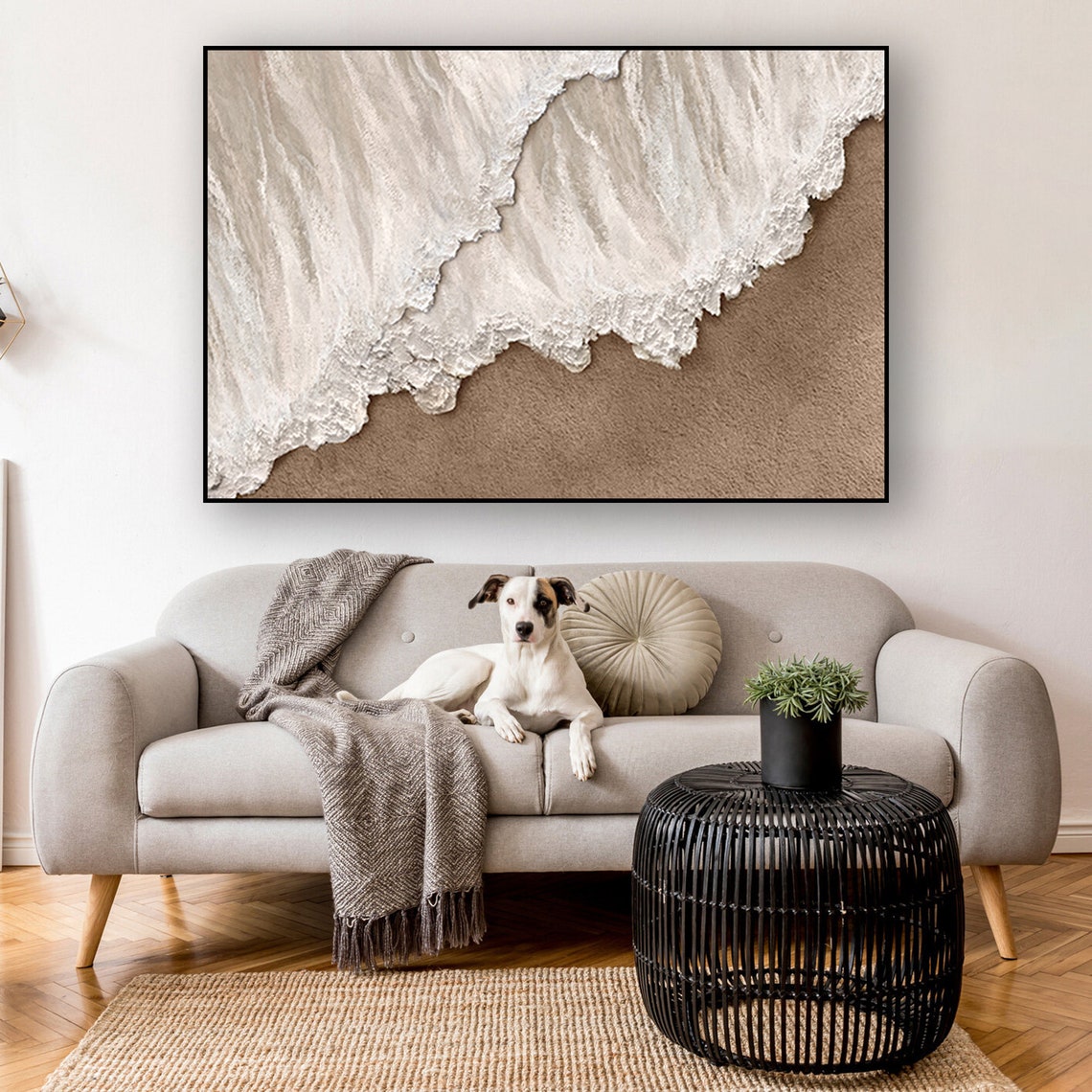 Neutral ocean abstract wall decor with textured white waves meeting sandy shore.