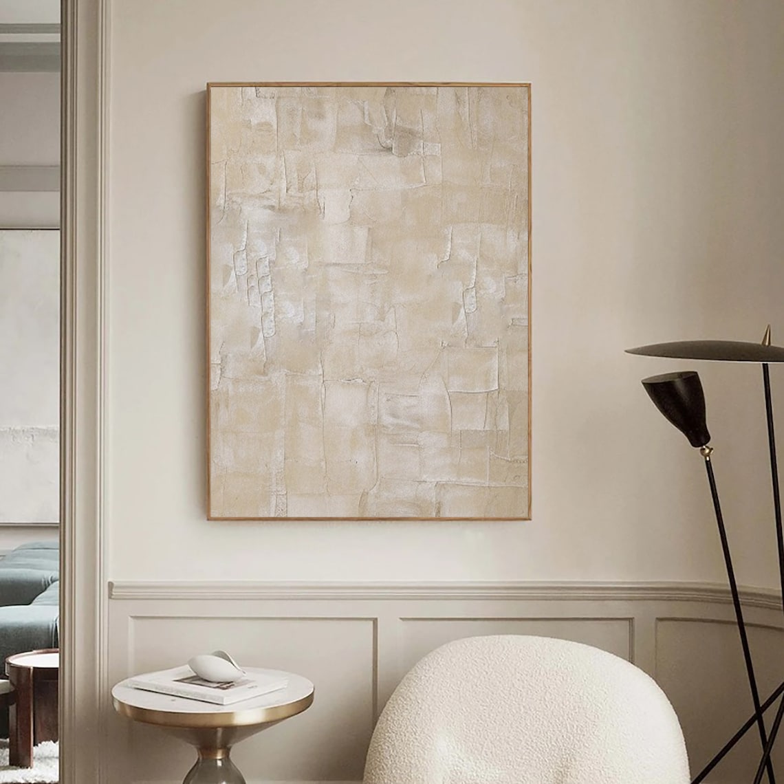 Textured wall decor with soft beige tones and layered abstract design.