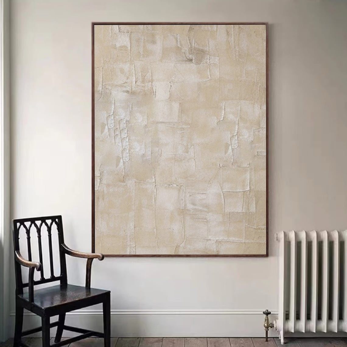 Textured wall decor with soft beige tones and layered abstract design.