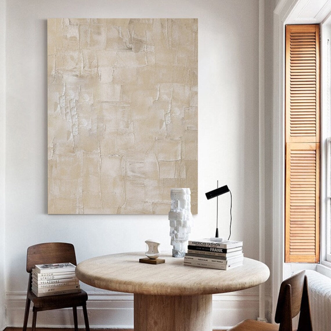 Textured wall decor with soft beige tones and layered abstract design.