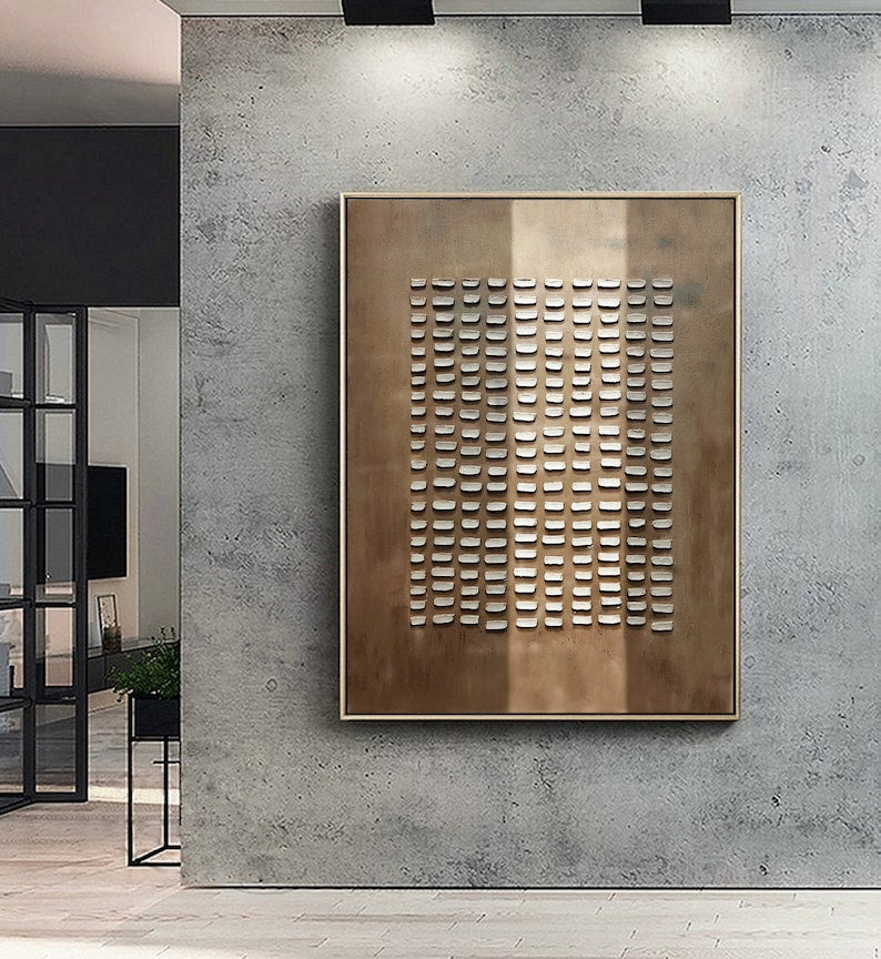 Modern minimalist art with uniform cutouts on a brushed bronze finish canvas.