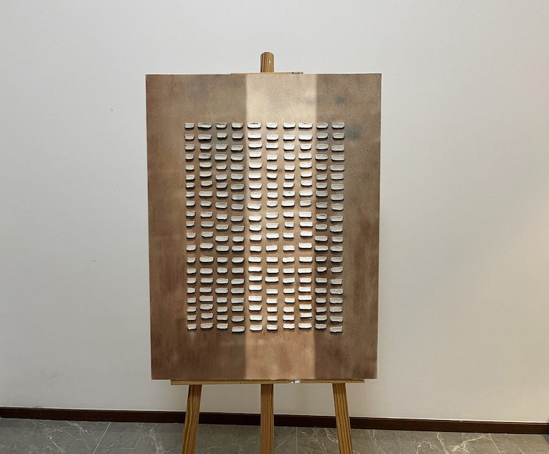 Modern minimalist art with uniform cutouts on a brushed bronze finish canvas.