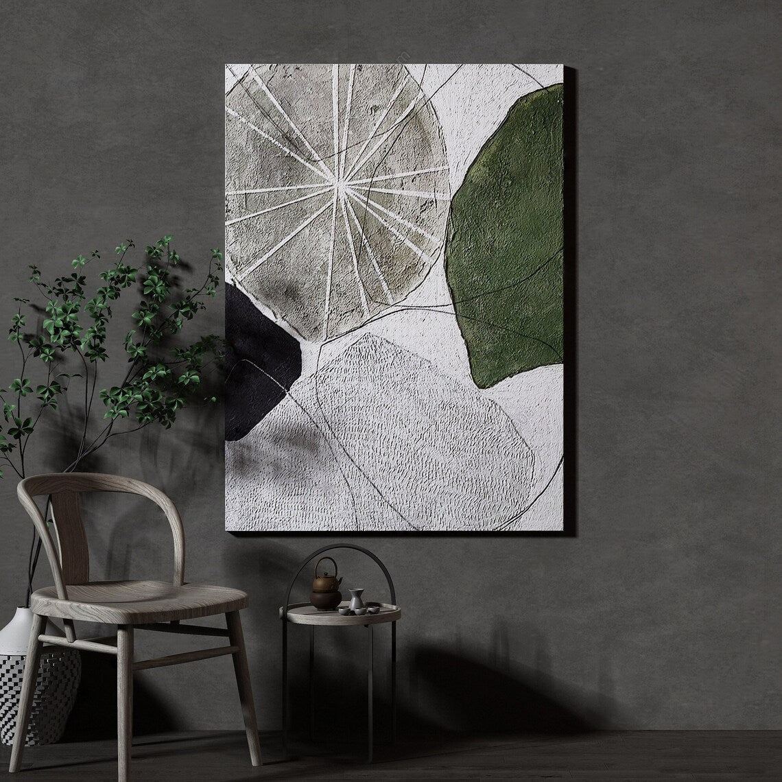 Abstract geometric wall art with textured shapes in green, black, and gray tones