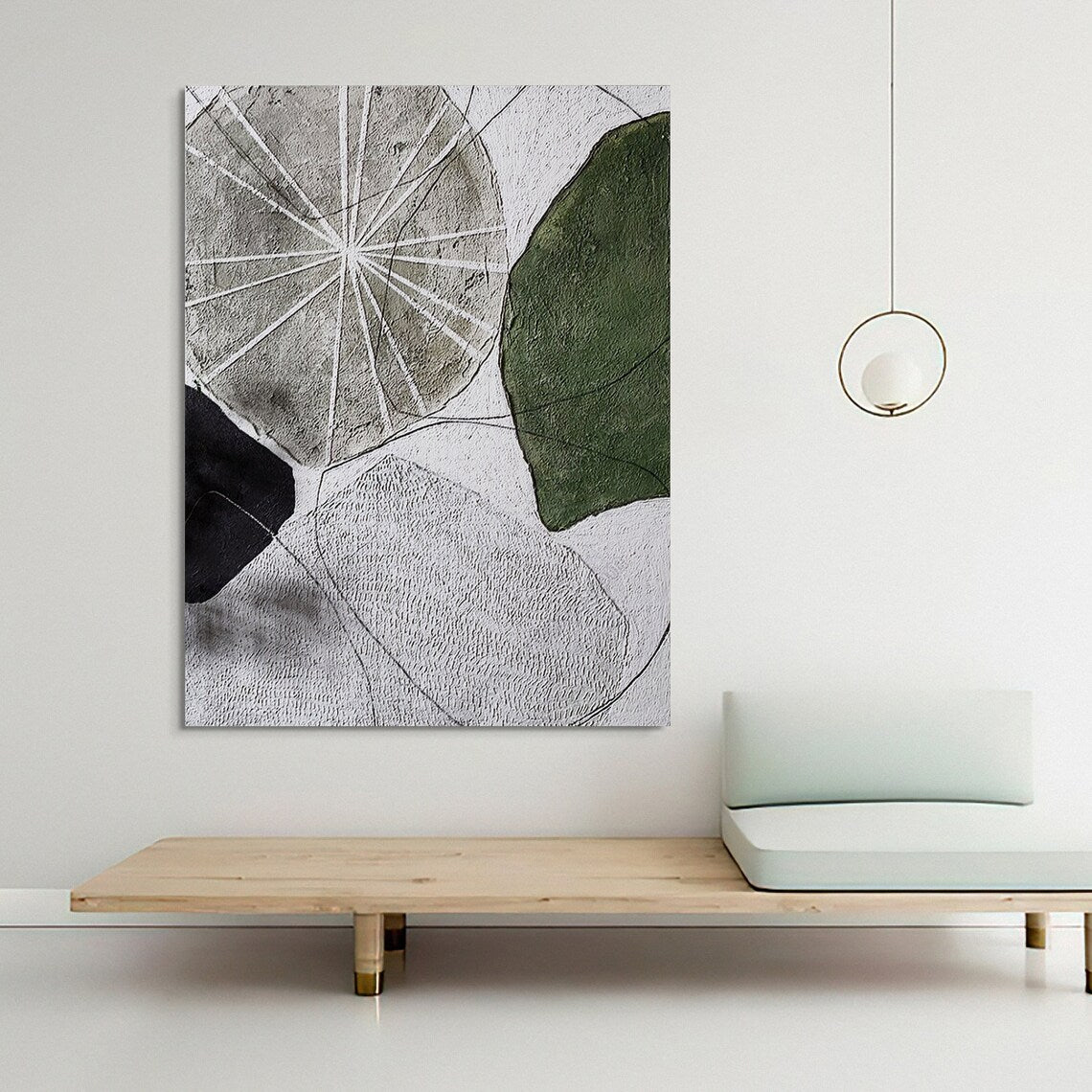 Abstract geometric wall art with textured shapes in green, black, and gray tones