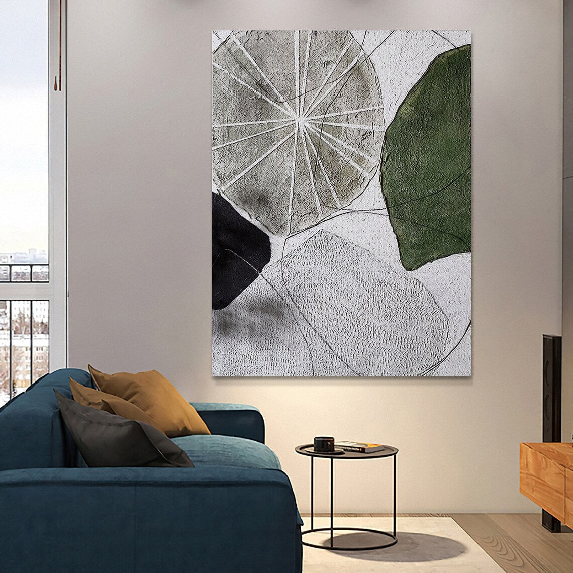 Abstract geometric wall art with textured shapes in green, black, and gray tones