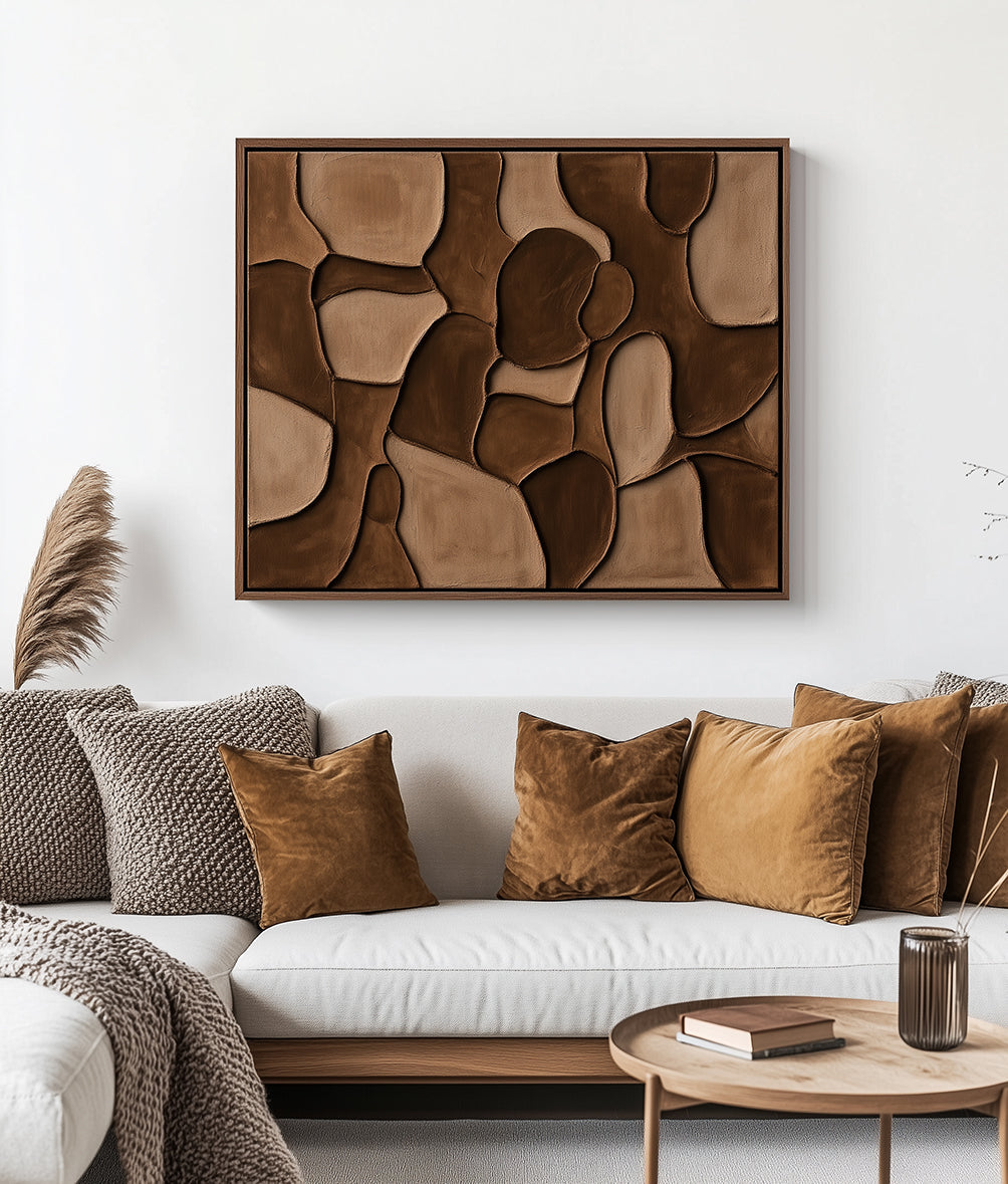 Abstract textured wall art in neutral tones with organic shapes.