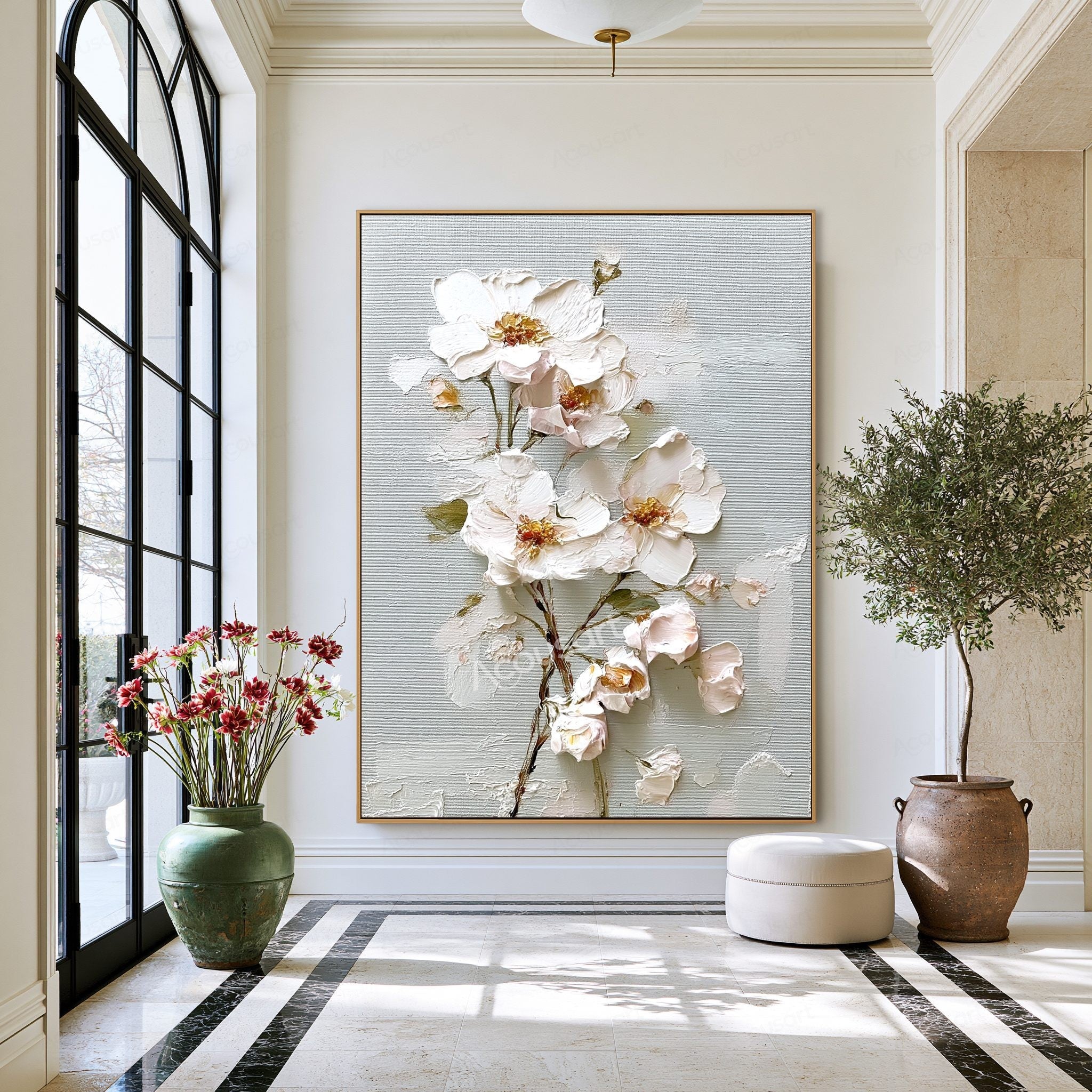 White textured floral wall art with blush flowers, gold centers, green leaves, and brown branches on a pale blue-gray background