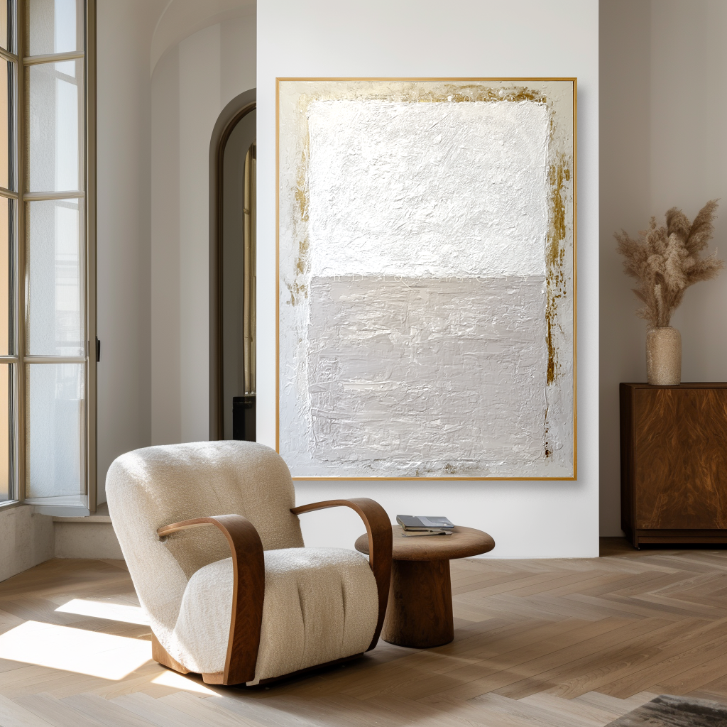 Minimalist abstract textured canvas art in soft white, beige, and gold accents.