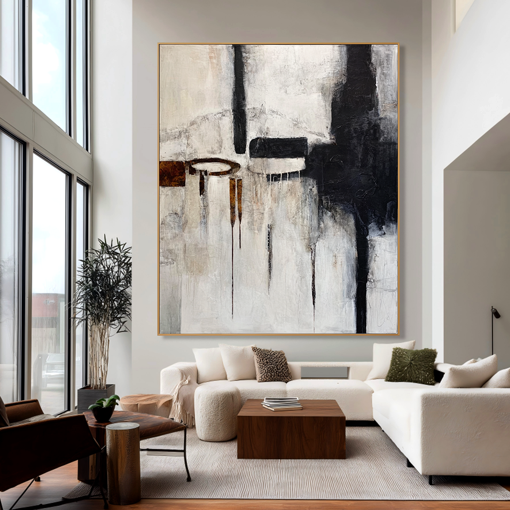 Abstract black, white, and brown geometric art with paint drips and textured elements.
