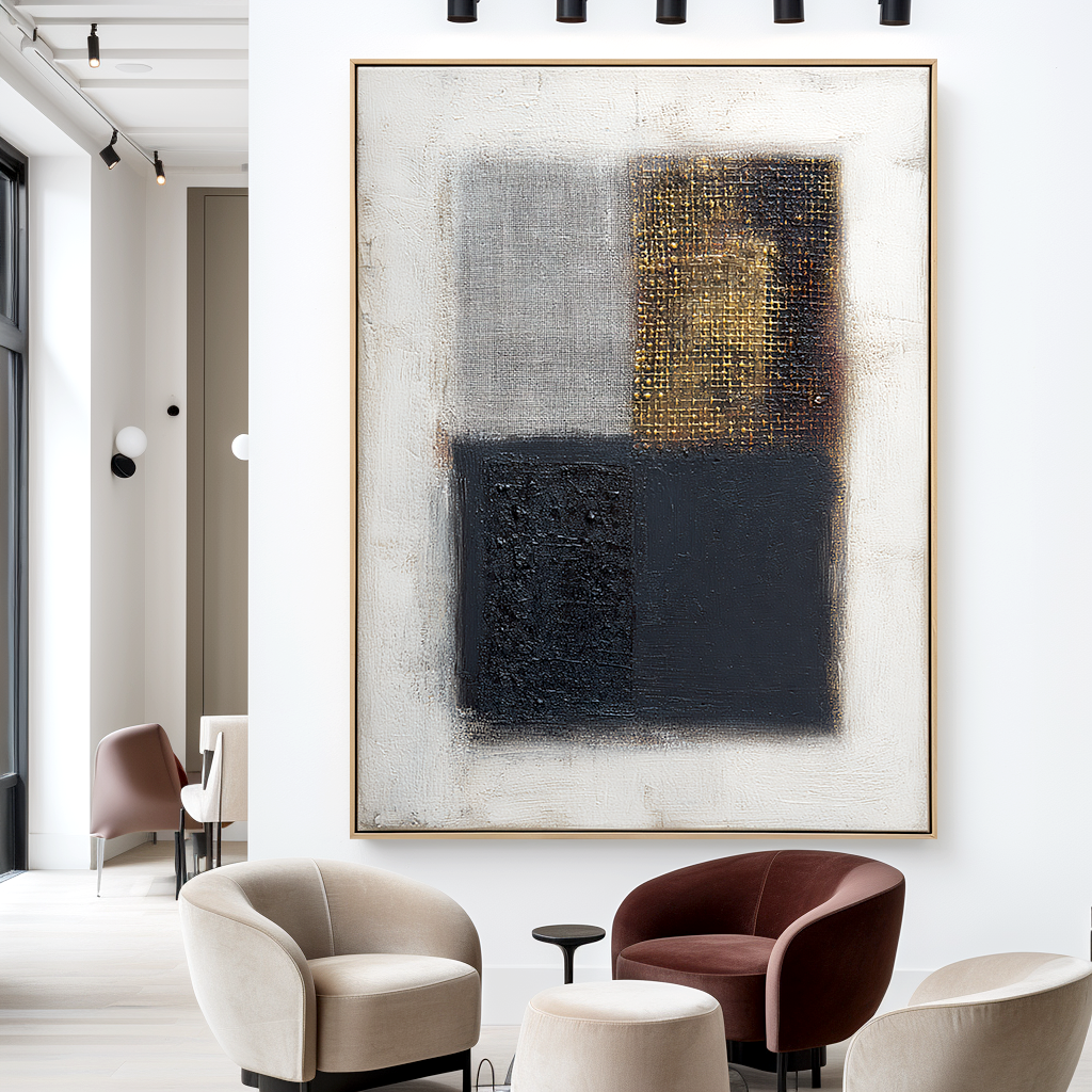 Abstract geometric art with black, gray, and gold textured squares on a white background.