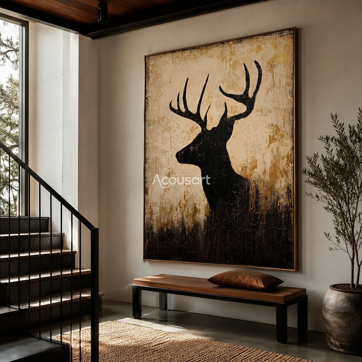 Black deer silhouette wall art with large antlers on a textured beige and brown background