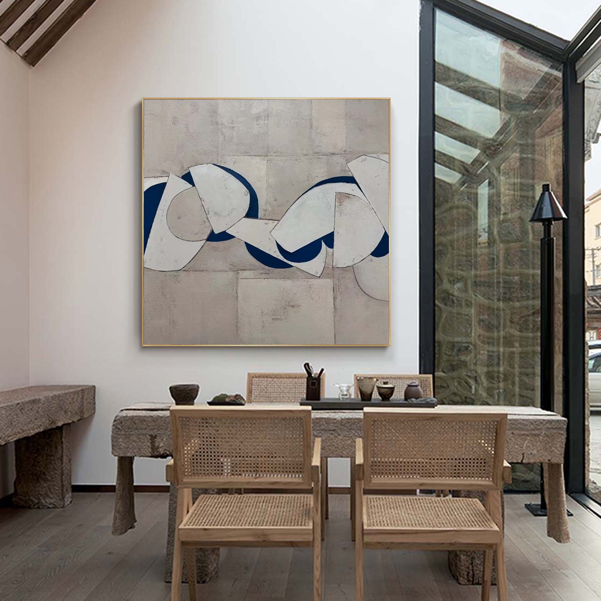 Blue and white abstract painting with bold curved shapes on textured gray background