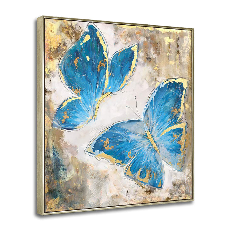 Butterfly canvas art with two blue butterflies accented by gold on textured background