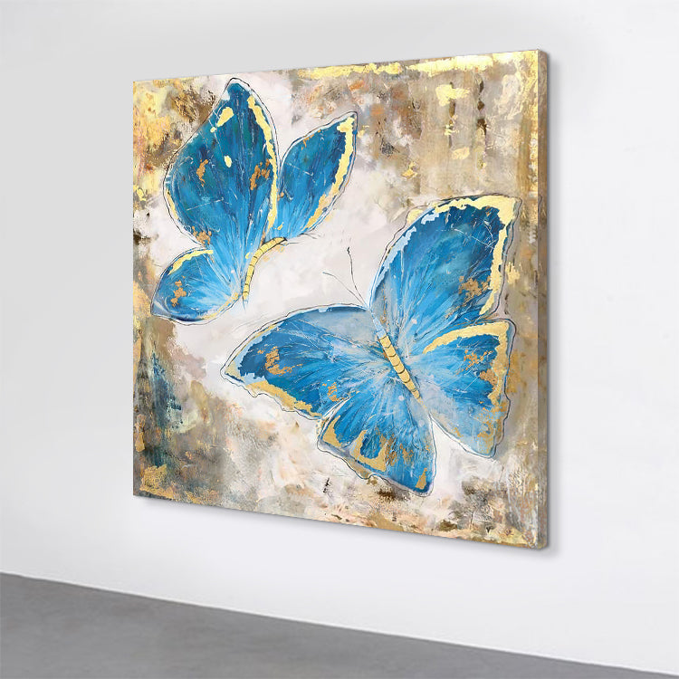Butterfly canvas art with two blue butterflies accented by gold on textured background