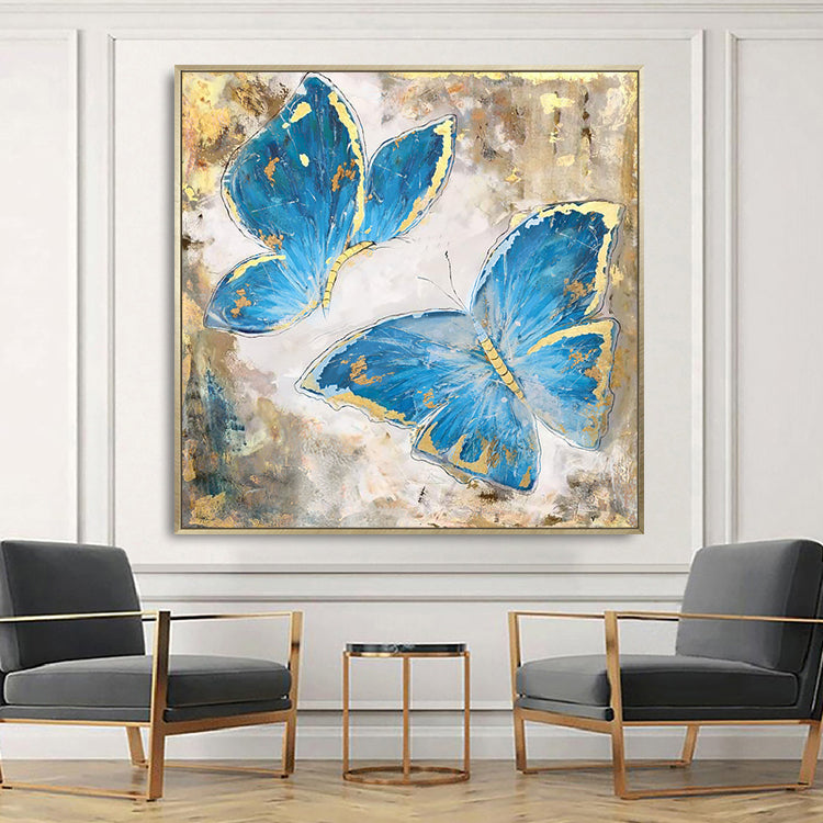 Butterfly canvas art with two blue butterflies accented by gold on textured background