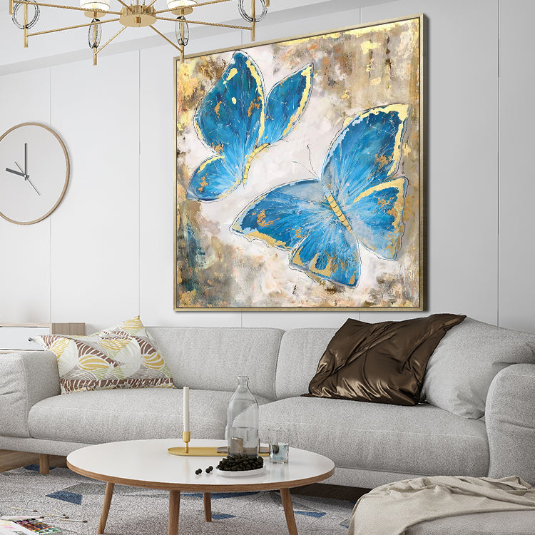 Butterfly canvas art with two blue butterflies accented by gold on textured background
