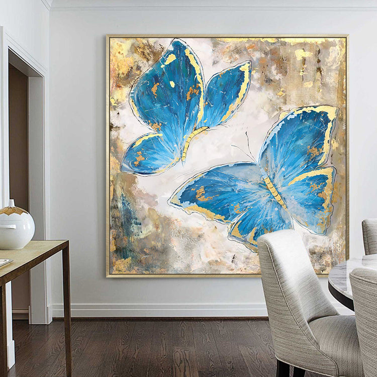 Butterfly canvas art with two blue butterflies accented by gold on textured background