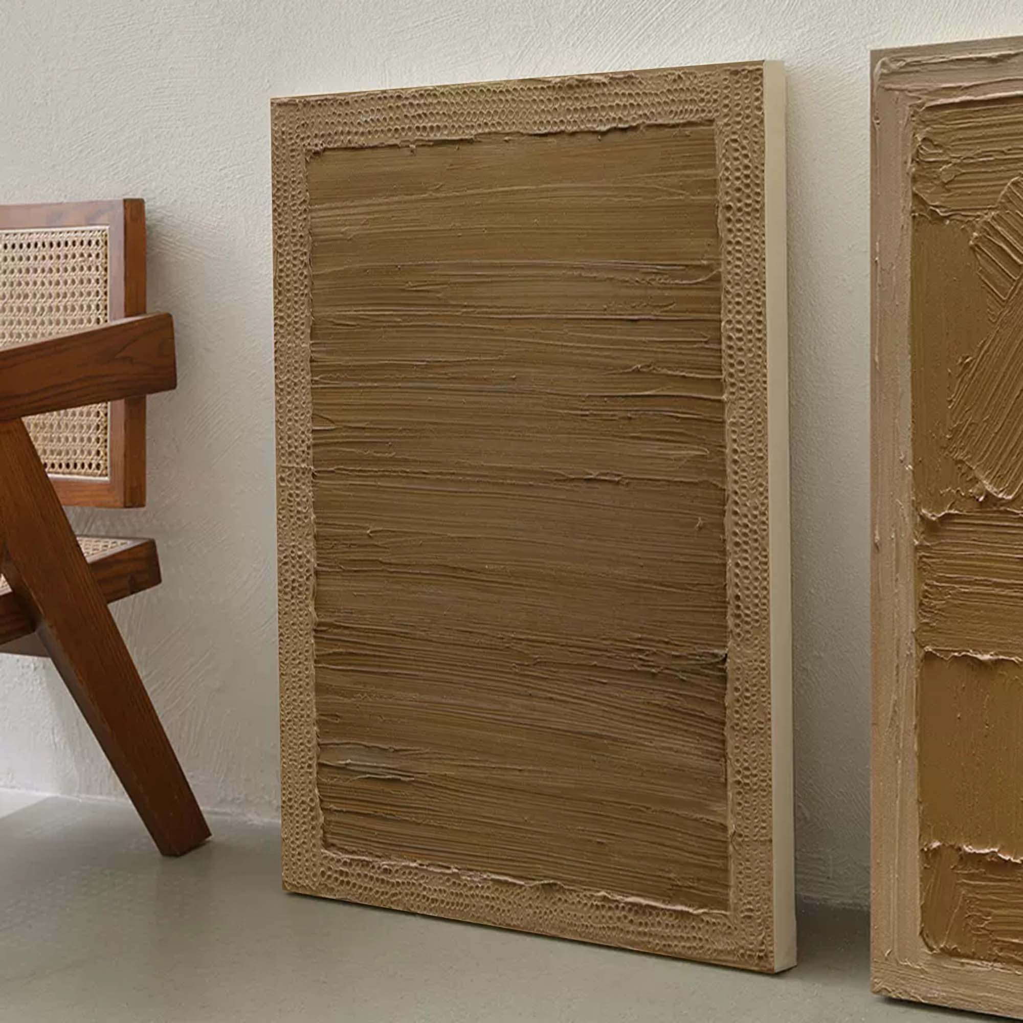 Large neutral wall art with textured earth-tone layers in abstract design