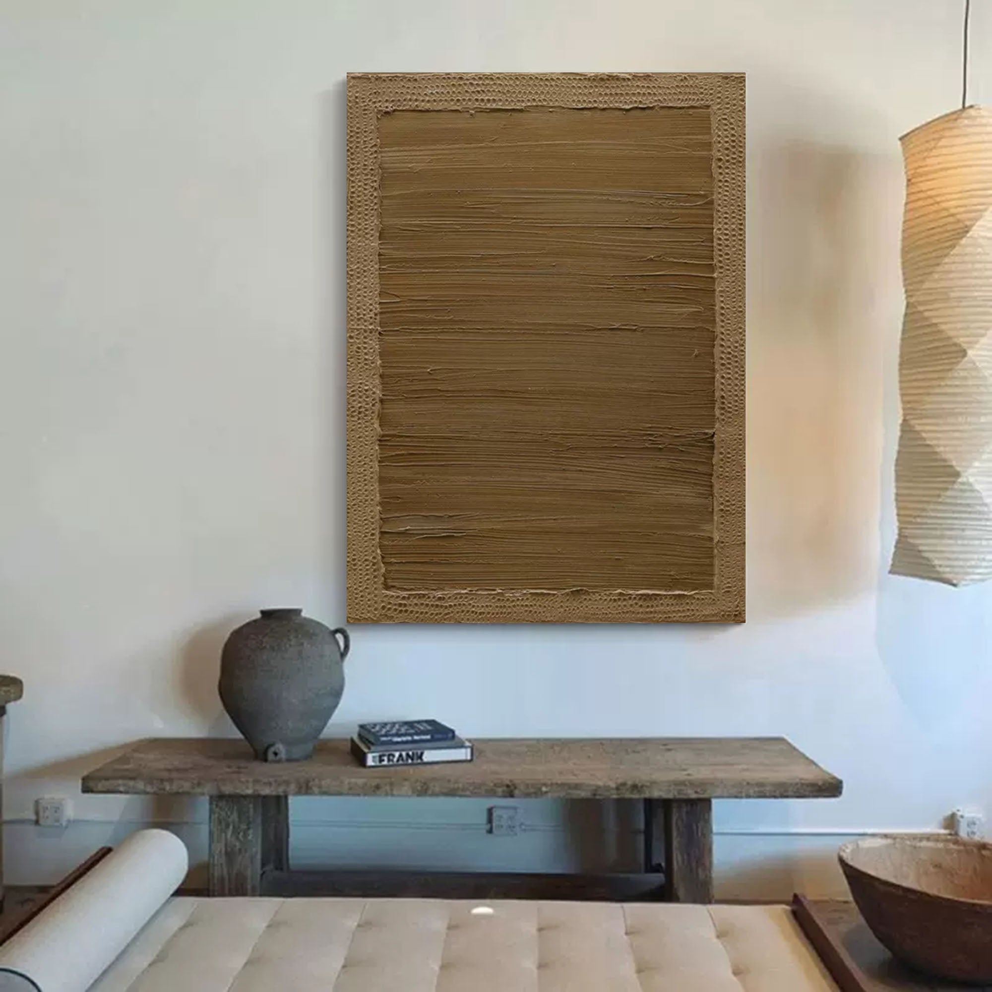 Large neutral wall art with textured earth-tone layers in abstract design