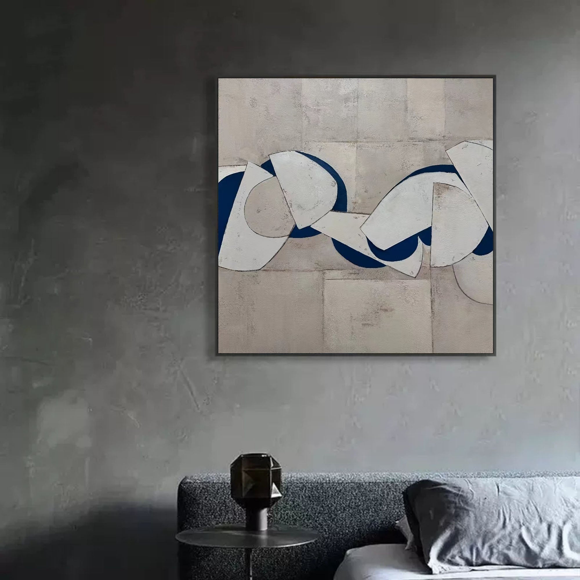 Blue and white abstract painting with bold curved shapes on textured gray background