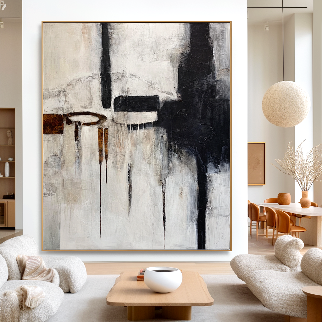 Abstract black, white, and brown geometric art with paint drips and textured elements.
