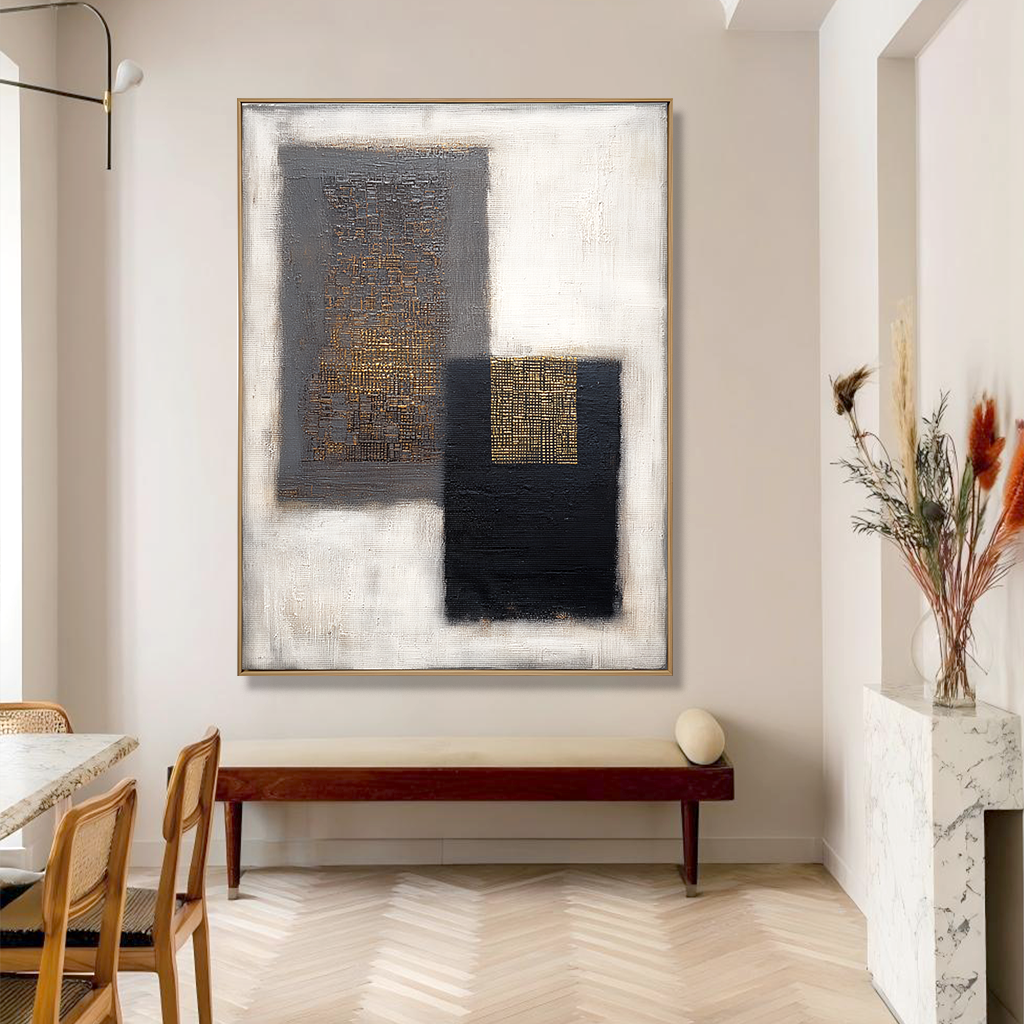 Abstract geometric art with black, gray, and gold textures on a white background.