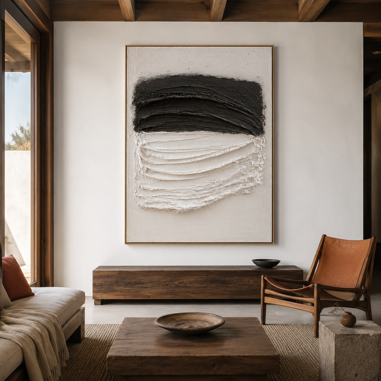 Black and white textured abstract wall art with layered charcoal and raised white brushstrokes on a neutral background