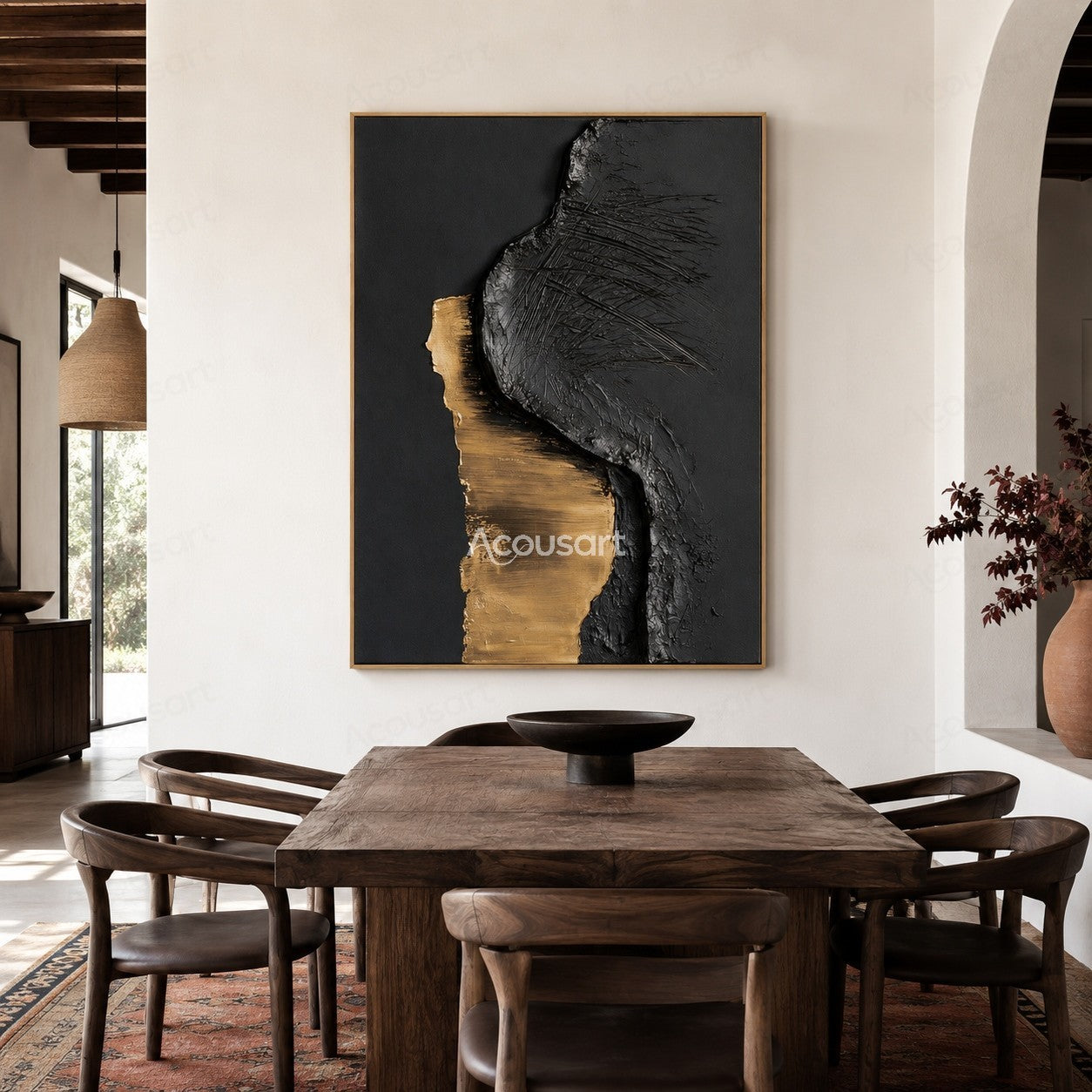 Black and gold textured abstract wall art with raised metallic gold shape and scratched black surface