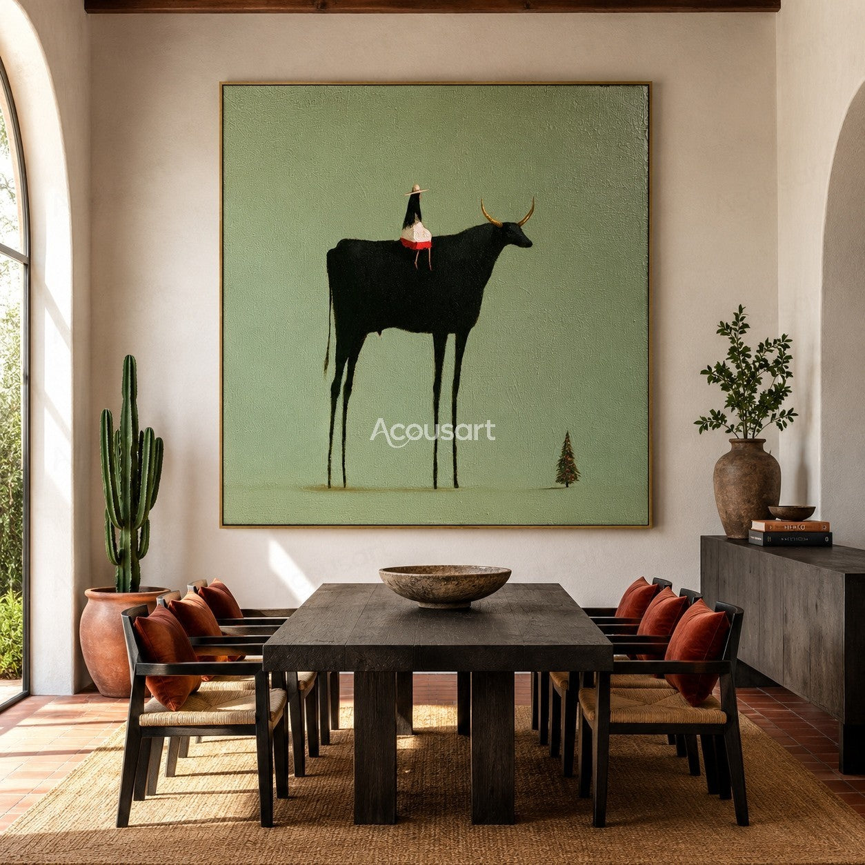 Minimalist western wall art featuring a black longhorn cow with small rider on a sage green background
