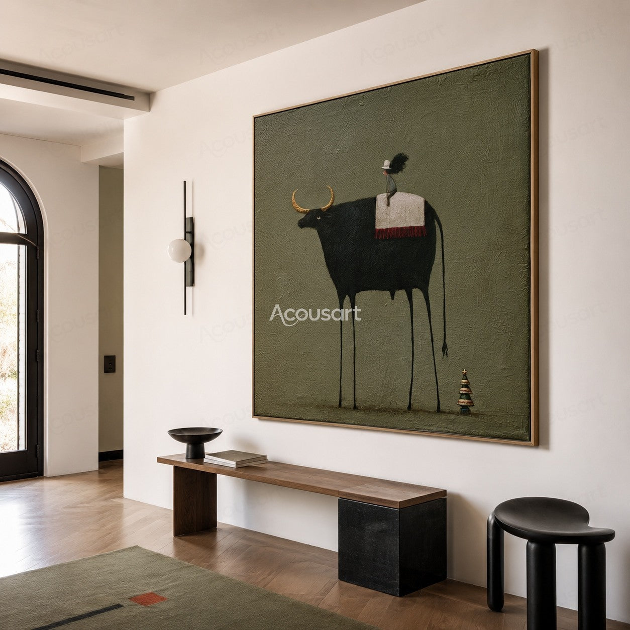 Minimalist black longhorn cow wall art with small rider, golden horns, green background, and tiny tree