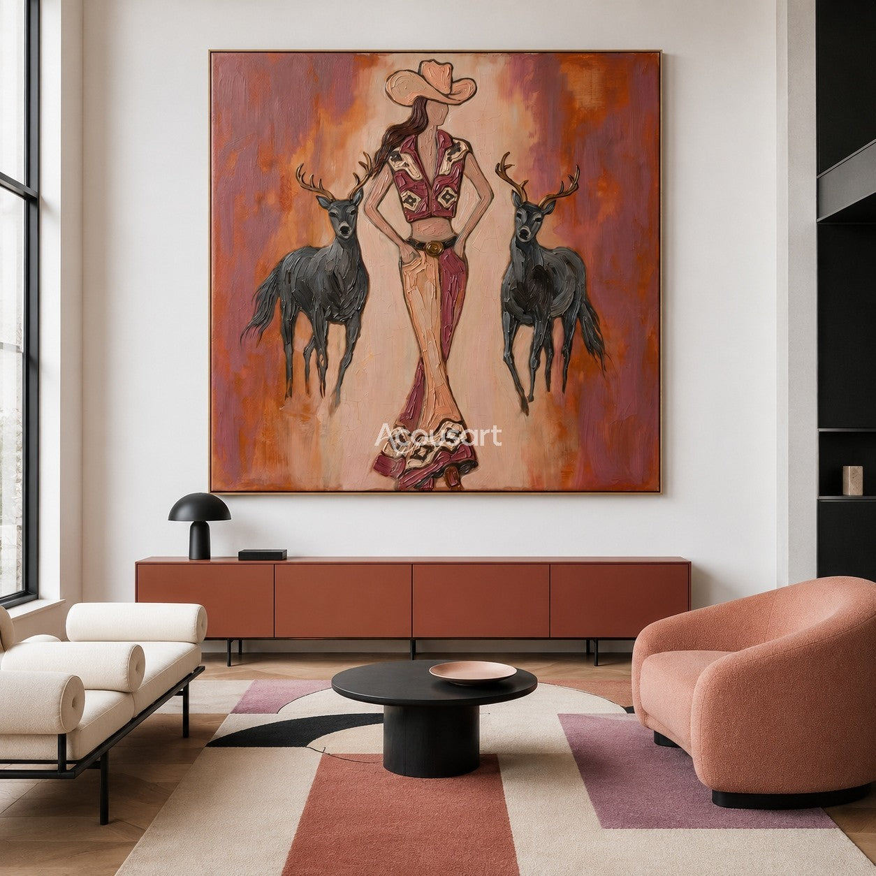 Textured western cowgirl wall art featuring a woman in bell-bottom pants standing with two black deer against a warm orange background.