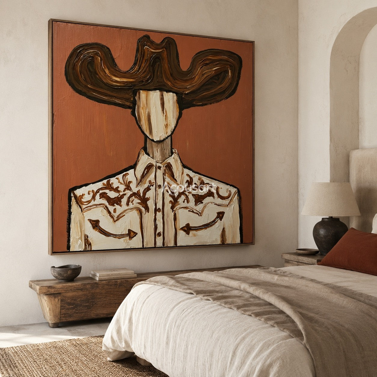 Textured cowboy wall art featuring a cowboy in a large brown hat and an embroidered western shirt against a terracotta background.