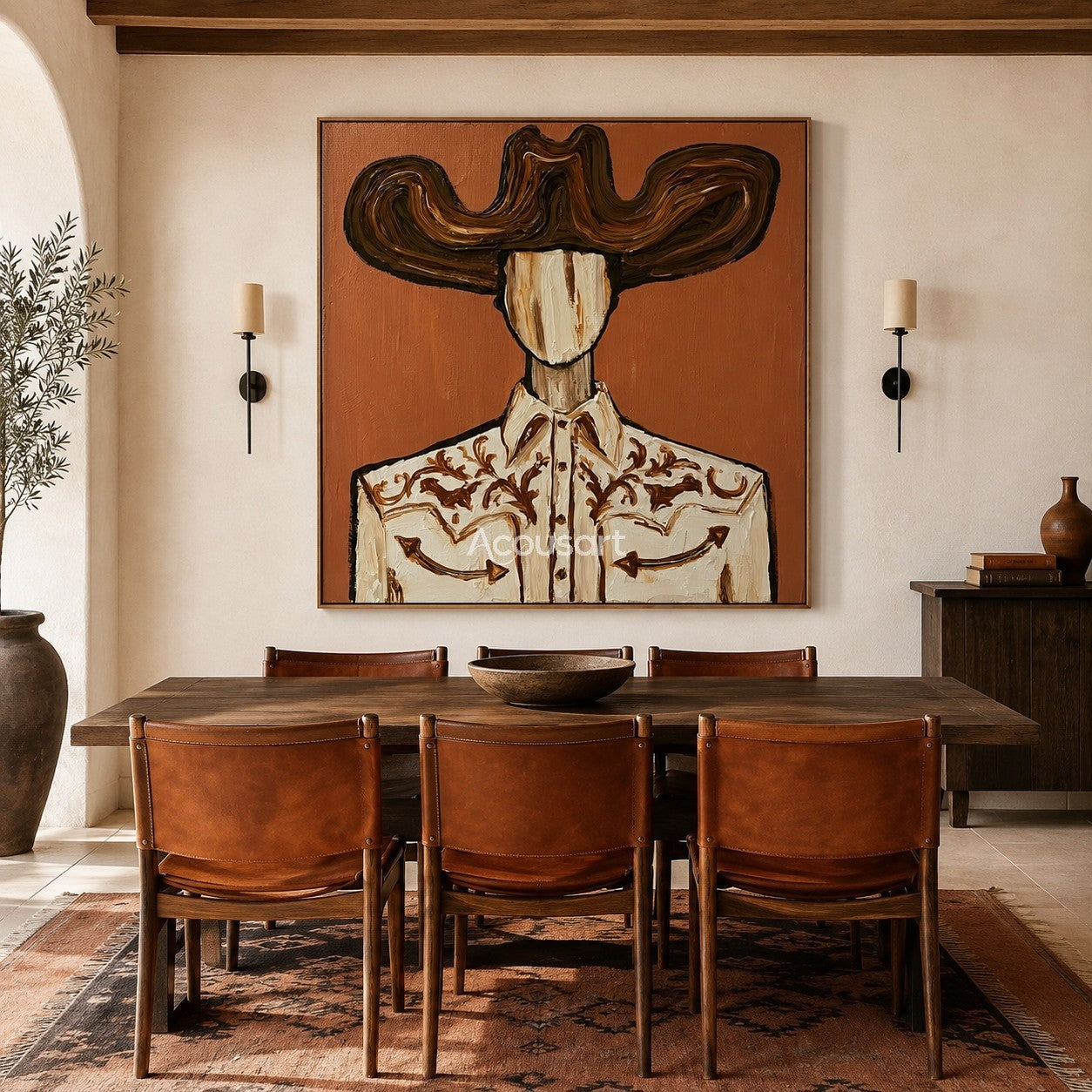 Textured cowboy wall art featuring a cowboy in a large brown hat and an embroidered western shirt against a terracotta background.