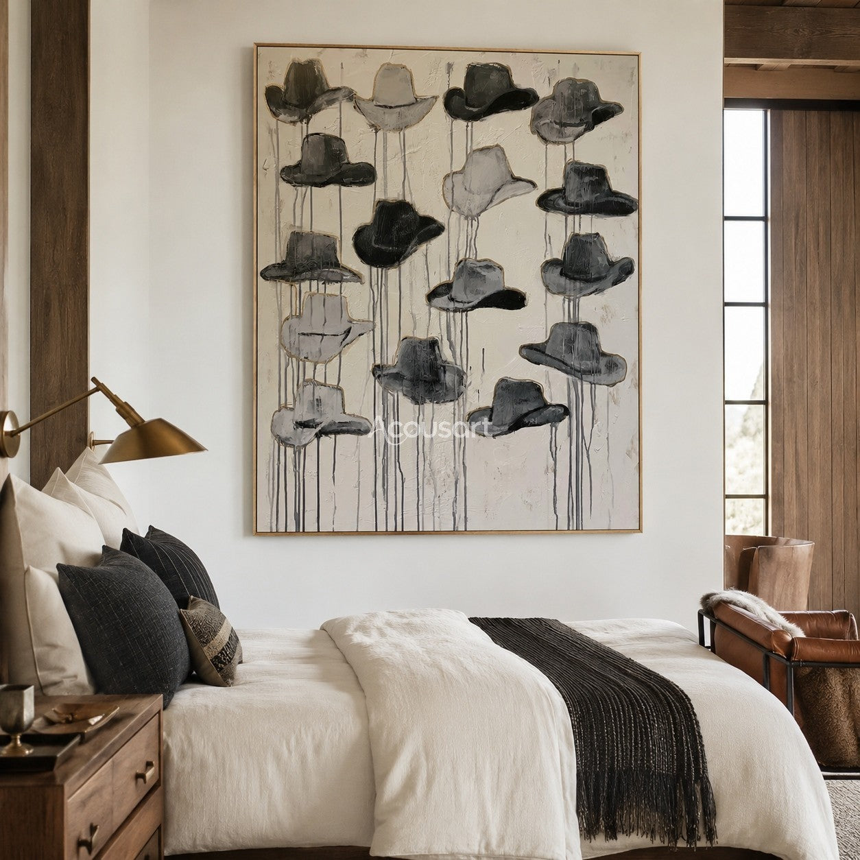 Textured western wall art featuring a collection of black and gray cowboy hats on a neutral background